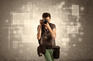 Photographer with professional camera gear and belt shooting